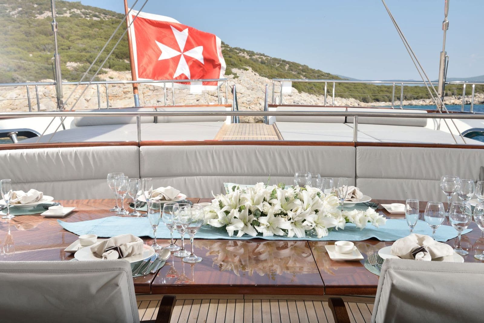 Dining table decorated with flowers on the aft deck of M/S MEIRA